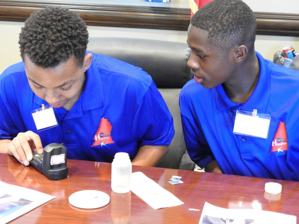 Students Jarden Bryson and Mike Greer learning about testing water