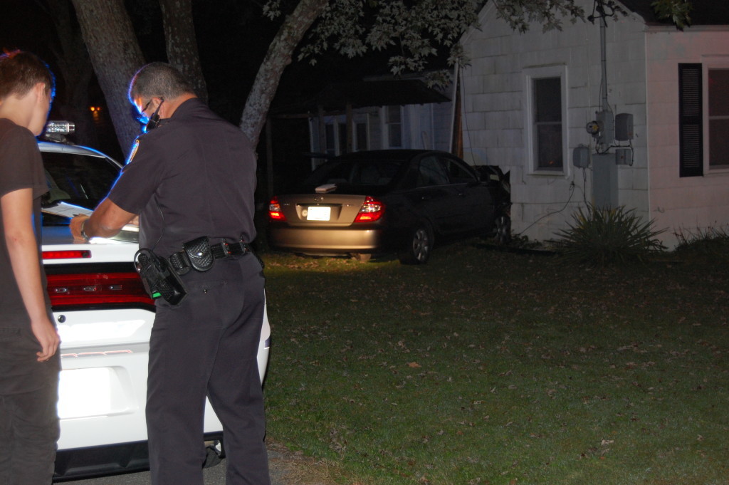 car v house with cop