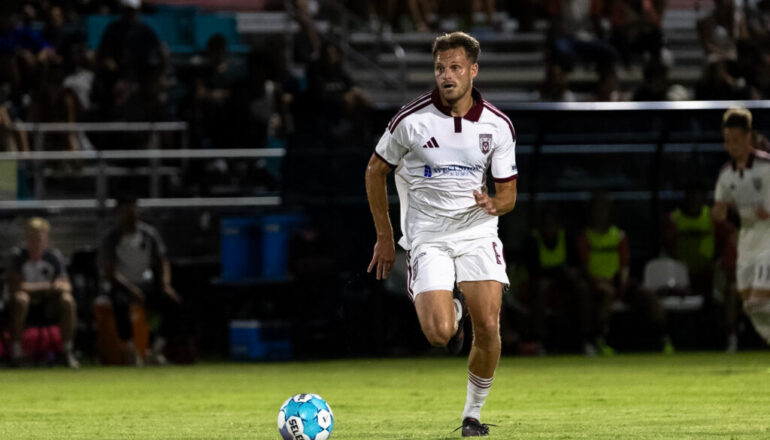 Red Wolves Edged on the Road